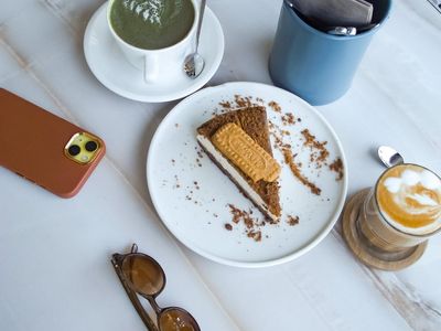Cup of tea and notebook on a wooden table