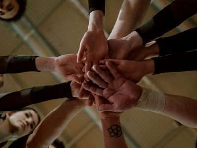 Hands joining together in a circle